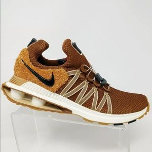 nike shox gravity elemental gold